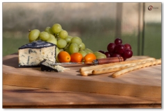 Cheese and Fruit Platter on Wooden Board