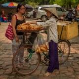 selling bread to tourist